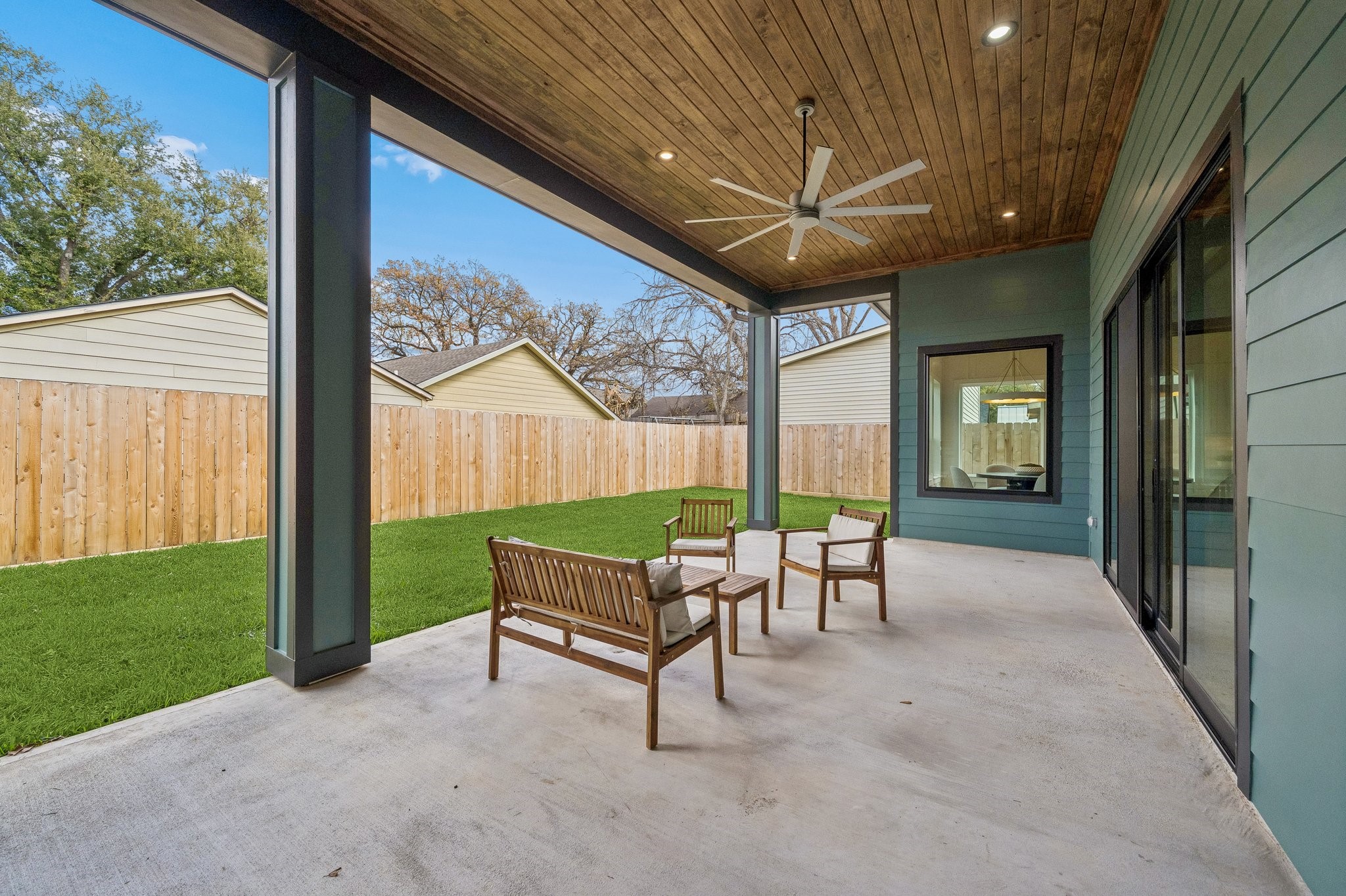 511 Graceland Street Houston, TX 77009 - Photo 19 of 43 This huge back covered patio has a wood paneled ceiling and fan. It's plumbed for an outdoor kitchen.
