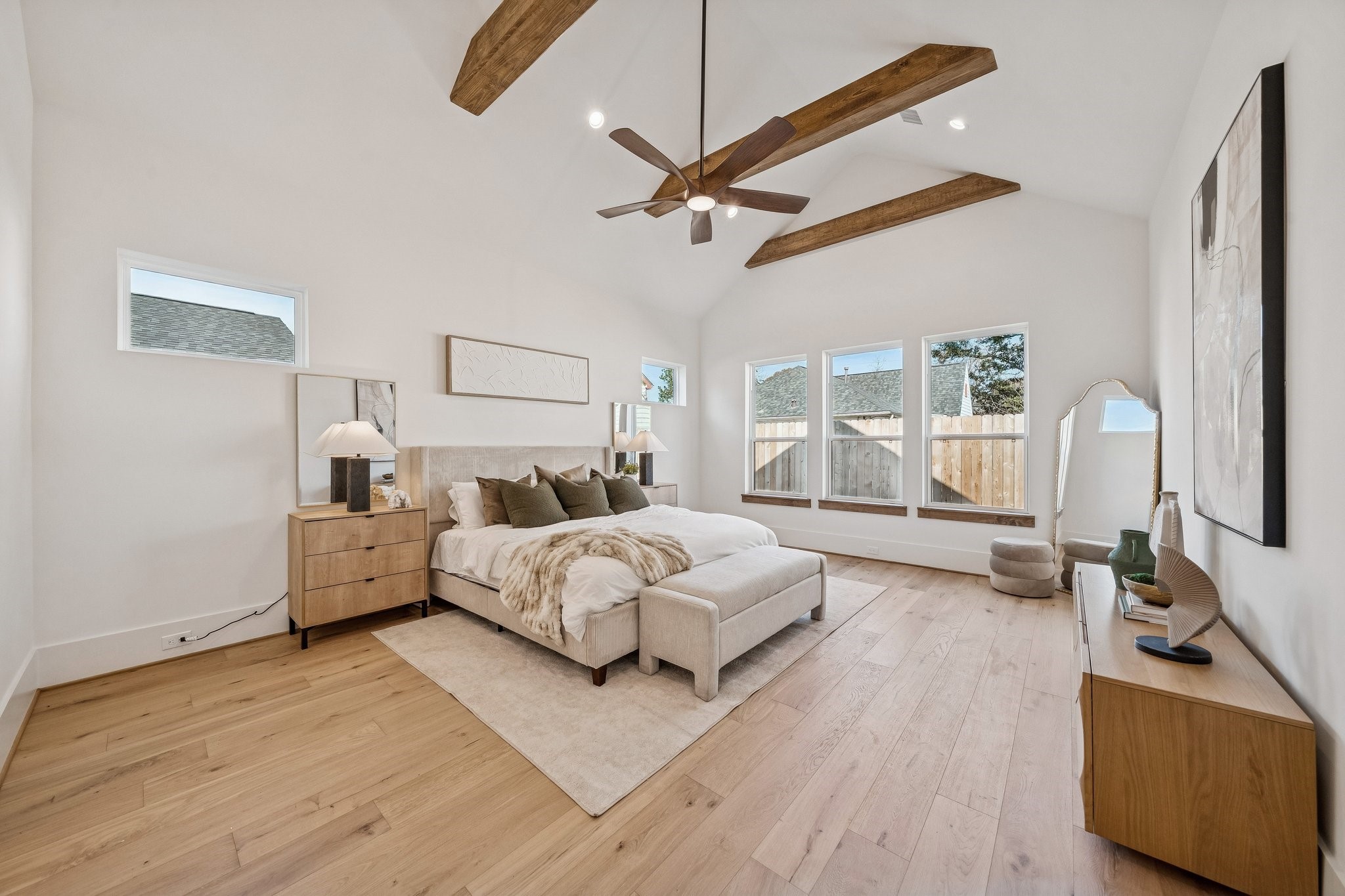 511 Graceland Street Houston, TX 77009 - Photo 20 of 43 Stunning primary bedroom with 15 foot vaulted ceilings and wood accent beams.