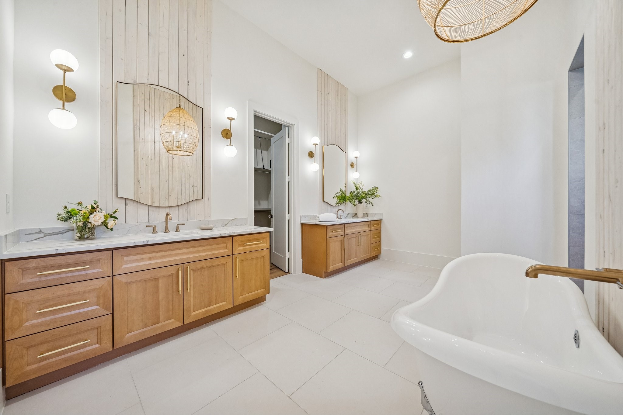 511 Graceland Street Houston, TX 77009 - Photo 22 of 43 The primary bathroom is luxuriously appointed from the clawfoot tub to the extended walk-in shower behind the tub wall. The closet is amazing and even has a hidden closet.