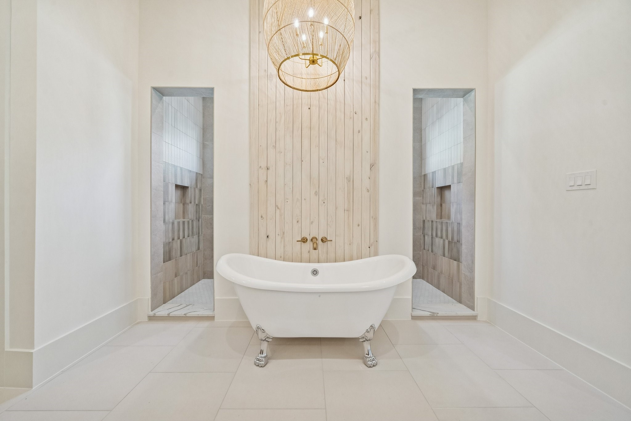 511 Graceland Street Houston, TX 77009 - Photo 24 of 43 Clawfoot tub with a wall of shoji washed wood and an oversized accent light above. The shower is behind the wall.
