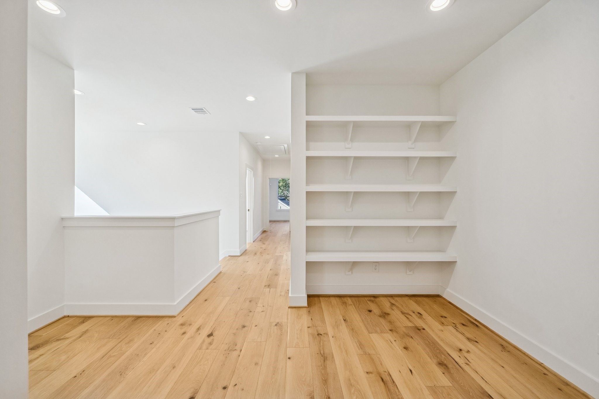 511 Graceland Street Houston, TX 77009 - Photo 30 of 43 Looking back towards the hallway from the reading nook and gameroom area.