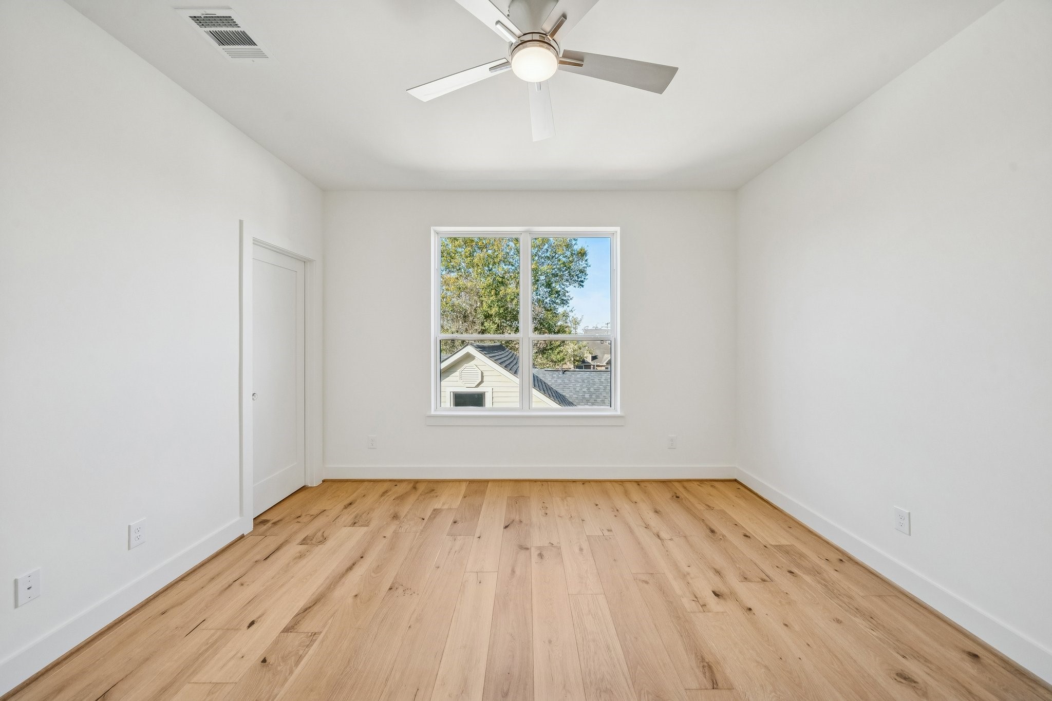511 Graceland Street Houston, TX 77009 - Photo 36 of 43 Upstairs secondary bedroom on the back side of the house. That door is to a huge closet. There is another door not shown to the walk-in attic.