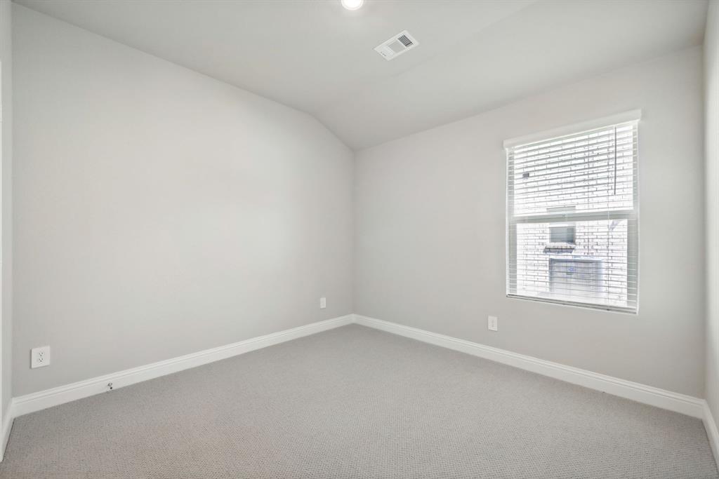 809 Sunflower Road Lavon, TX 75166 - Photo 17 of 32 an empty room with a window
