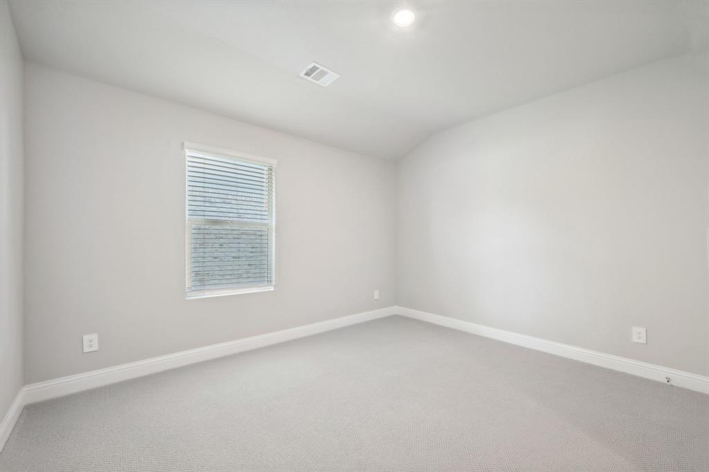 809 Sunflower Road Lavon, TX 75166 - Photo 20 of 32 an empty room with a window