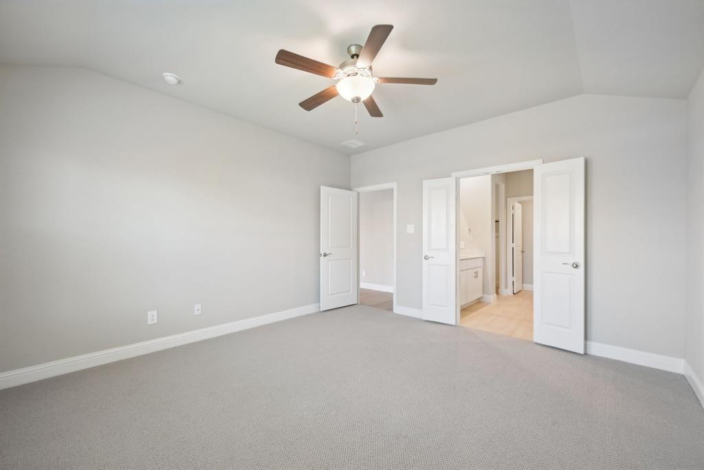 809 Sunflower Road Lavon, TX 75166 - Photo 24 of 32 an empty room with closet and fan