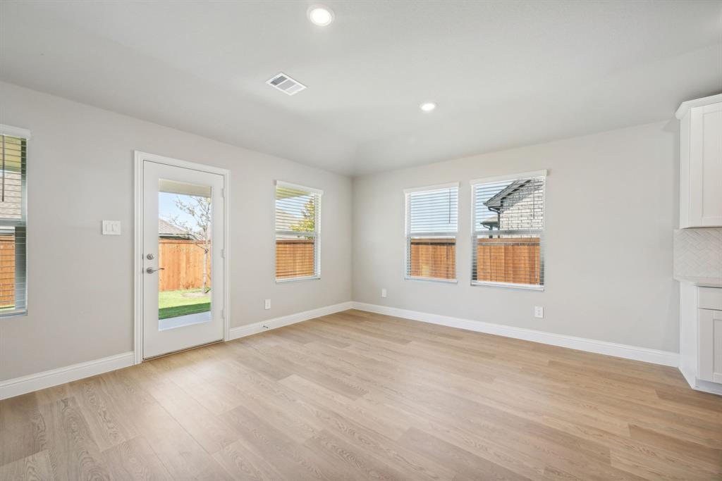 809 Sunflower Road Lavon, TX 75166 - Photo 9 of 32 an empty room with windows