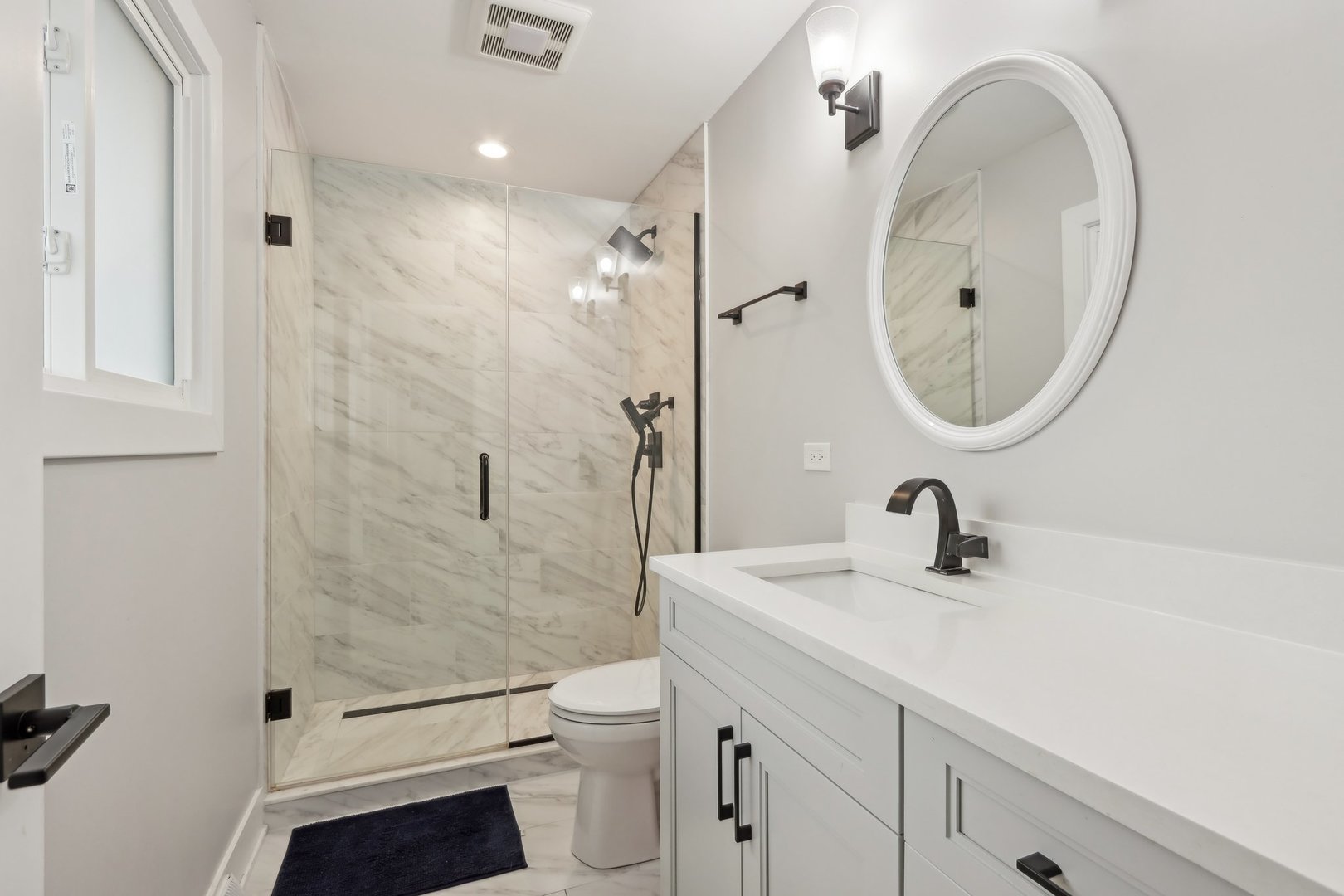 2542 Woodlawn Road Northbrook, IL 60062 - Photo 17 of 38 a bathroom with a sink a toilet and shower