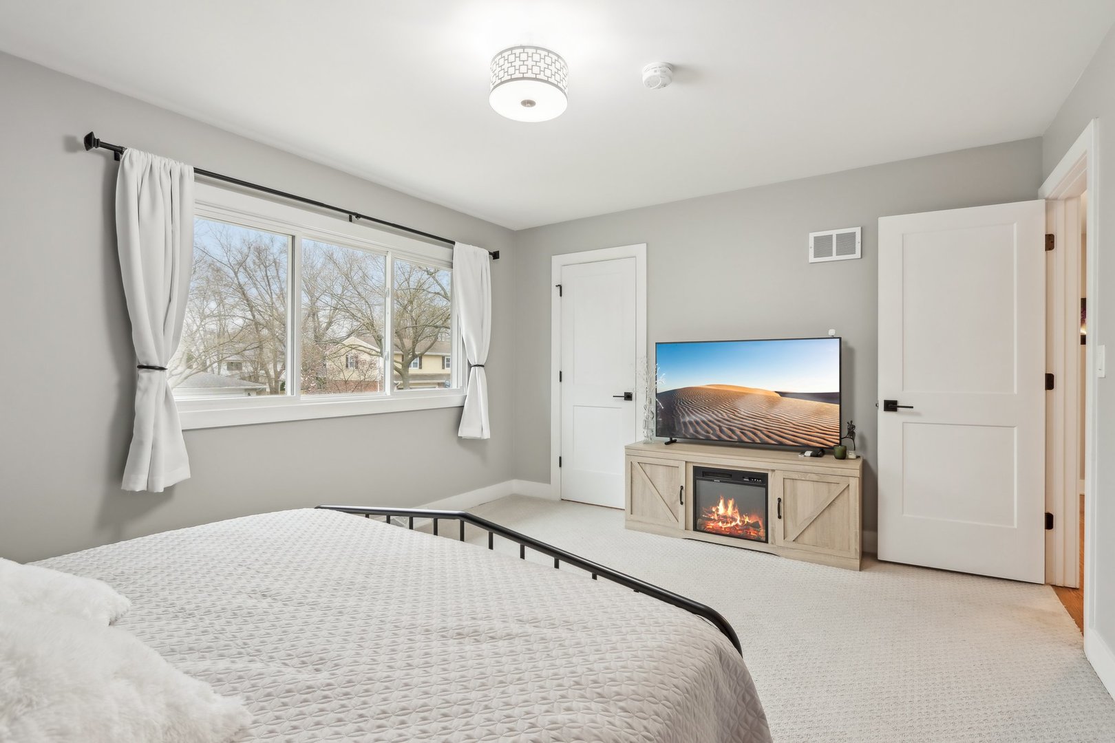 2542 Woodlawn Road Northbrook, IL 60062 - Photo 19 of 38 a bedroom with a bed and a fireplace