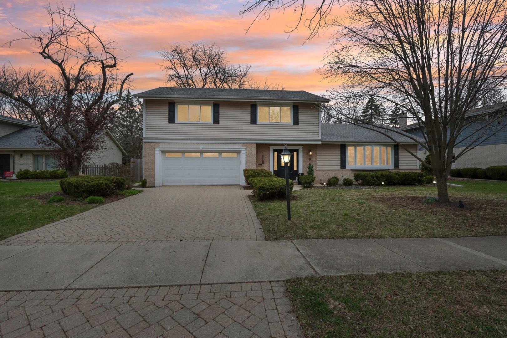 2542 Woodlawn Road Northbrook, IL 60062 - Photo 33 of 38 a front view of a house with a yard and trees