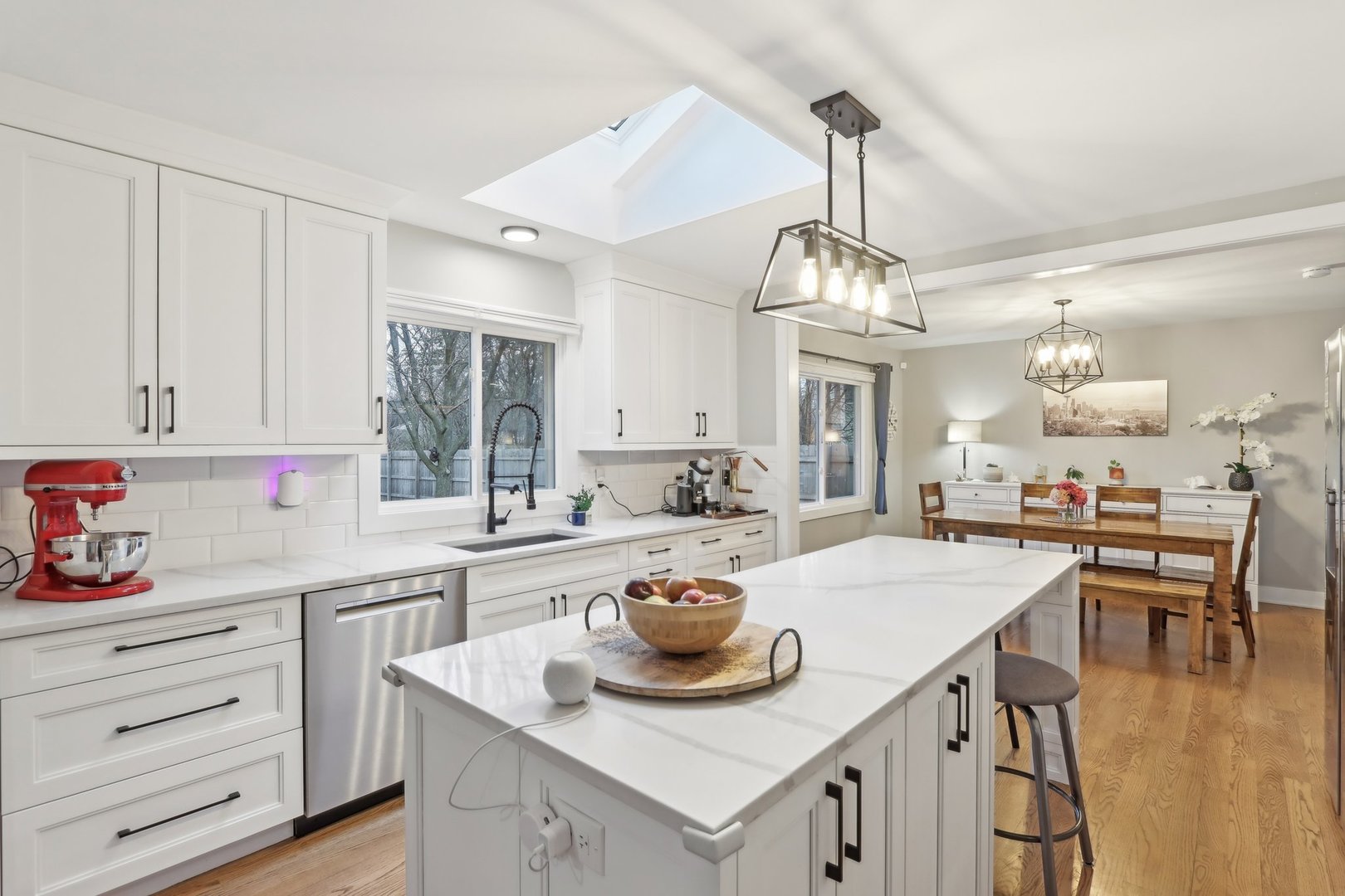 2542 Woodlawn Road Northbrook, IL 60062 - Photo 5 of 38 a kitchen with a stove a table and chairs in it