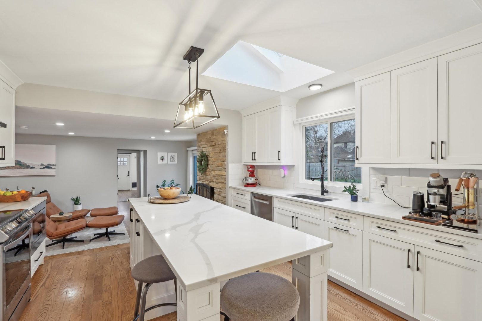 2542 Woodlawn Road Northbrook, IL 60062 - Photo 7 of 38 a kitchen with a stove a sink a dining table and chairs
