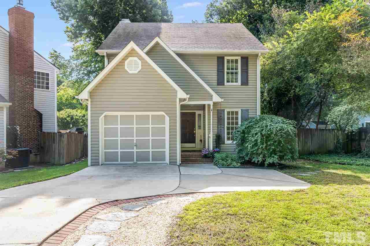 5504 Spring Pines Way Raleigh, NC 27616 - Photo 2 of 25 a front view of a house with a yard and garage