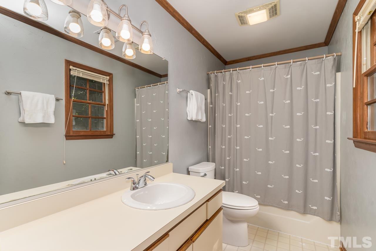 5504 Spring Pines Way Raleigh, NC 27616 - Photo 16 of 25 a bathroom with a sink a toilet and shower