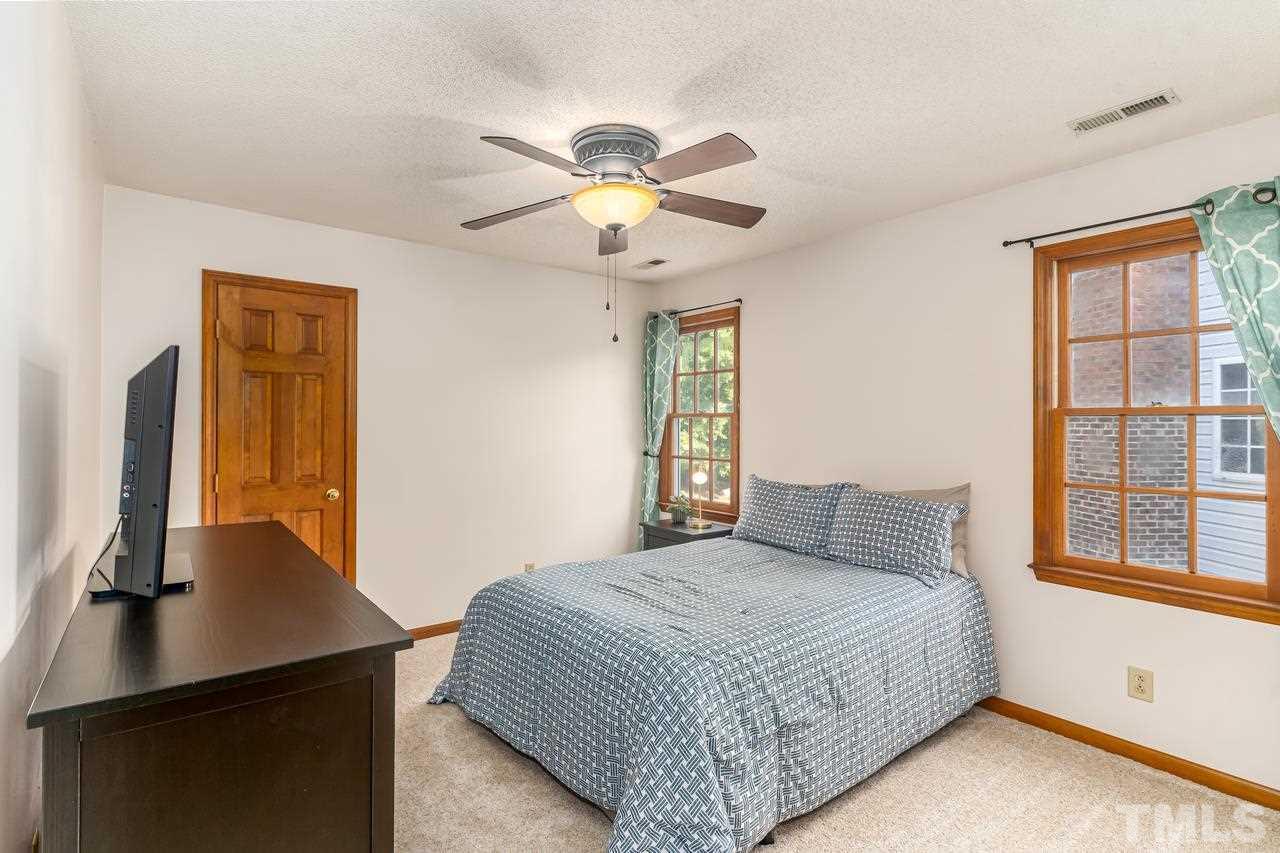 5504 Spring Pines Way Raleigh, NC 27616 - Photo 17 of 25 a bedroom with a bed and a window