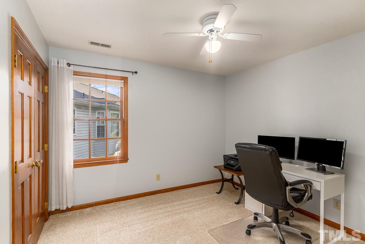 5504 Spring Pines Way Raleigh, NC 27616 - Photo 19 of 25 a view of a workspace with furniture and a window