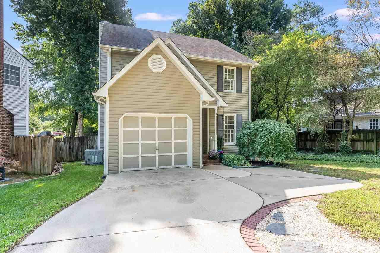 5504 Spring Pines Way Raleigh, NC 27616 - Photo 21 of 25 a view of a house with a yard and garage