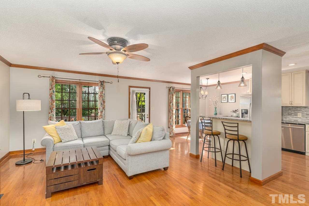5504 Spring Pines Way Raleigh, NC 27616 - Photo 6 of 25 a living room with furniture and a large window