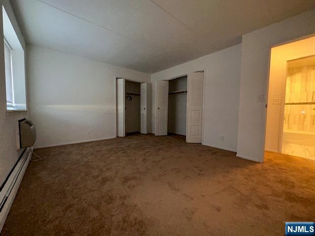 873 Main Street, Unit 2C Hackensack, NJ 07601 - Photo 13 of 19 an empty room with windows