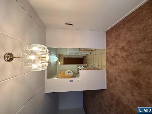 873 Main Street, Unit 2C Hackensack, NJ 07601 - Photo 6 of 19 a view of a livingroom with a chandelier