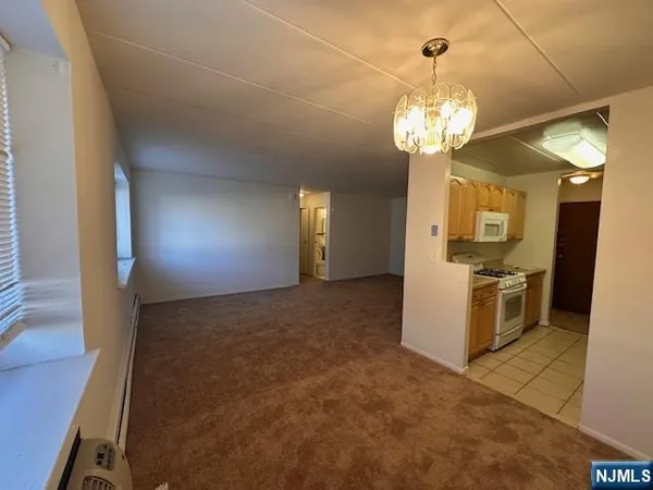 a view of a kitchen from the hallway