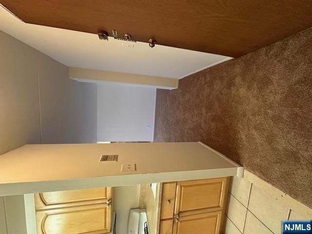 873 Main Street, Unit 2C Hackensack, NJ 07601 - Photo 8 of 19 a view of a kitchen from the hallway