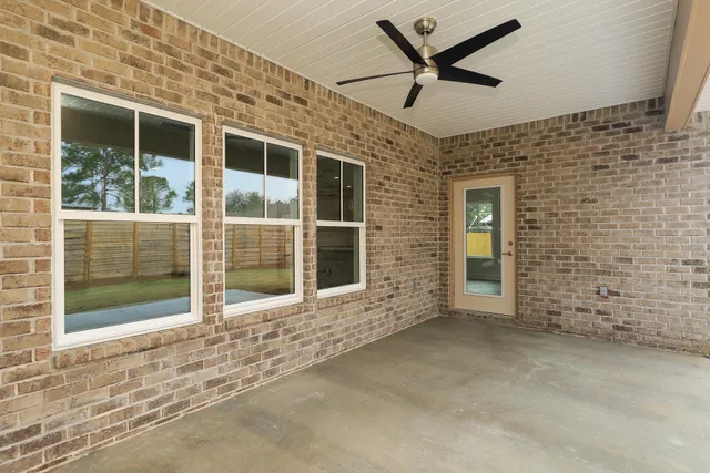 a view of backyard with seating area