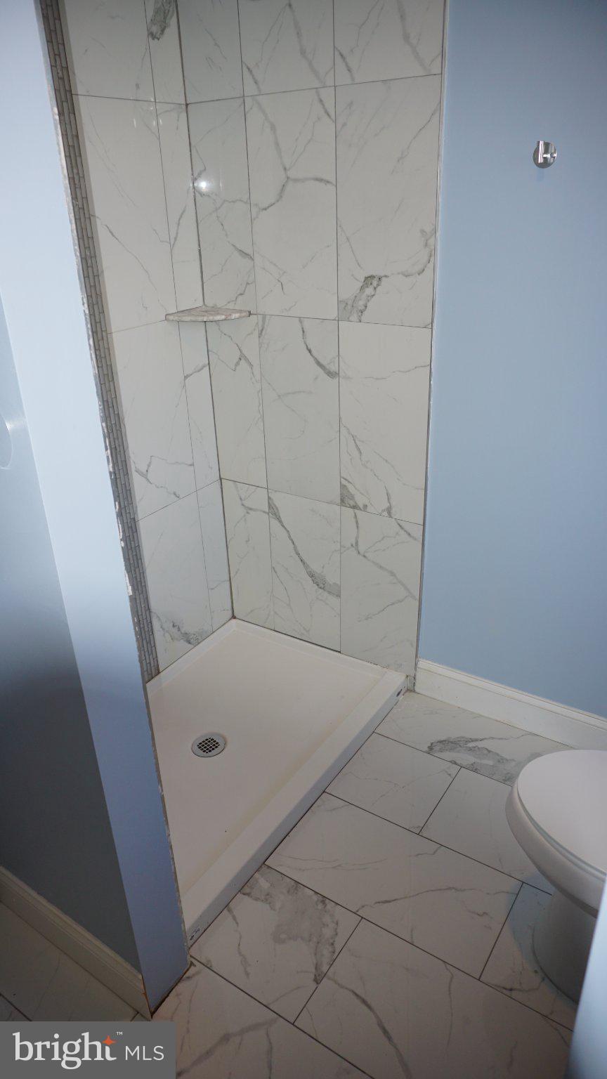 5854 Deale Churchton Road Deale, MD 20751 - Photo 27 of 57 Modern shower with elegant tiles.