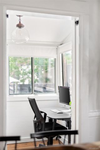 a view of a dining room with furniture and window