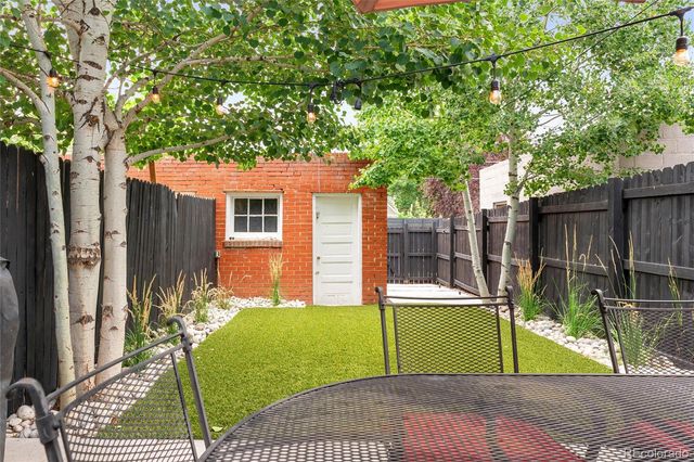 a view of a backyard with a small cabin