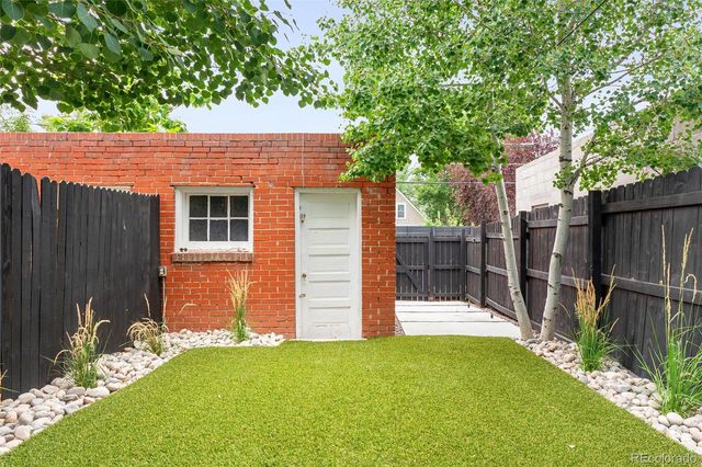 a backyard of a house with trampoline