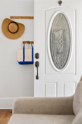 a living room with a couch and chandelier