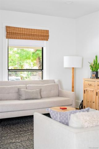 a living room with a couch and a large window