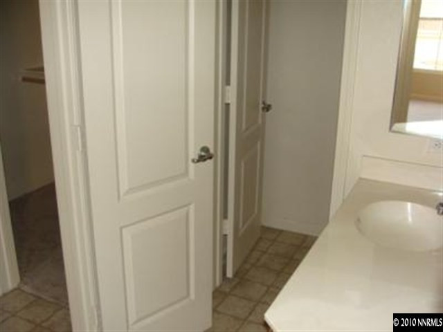 9050 Double R, Unit 922 Reno, NV 89521 - Photo 6 of 9 a bathroom with a sink and a shower
