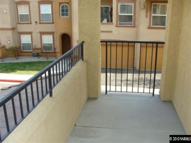9050 Double R, Unit 922 Reno, NV 89521 - Photo 8 of 9 a view of a building from a porch