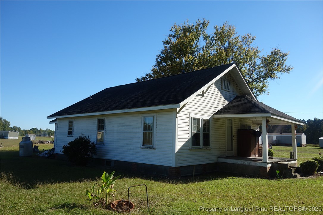 5375 Wire Grass Road Orrum, NC 28369 - Photo 3 of 4 a front view of a house with a yard