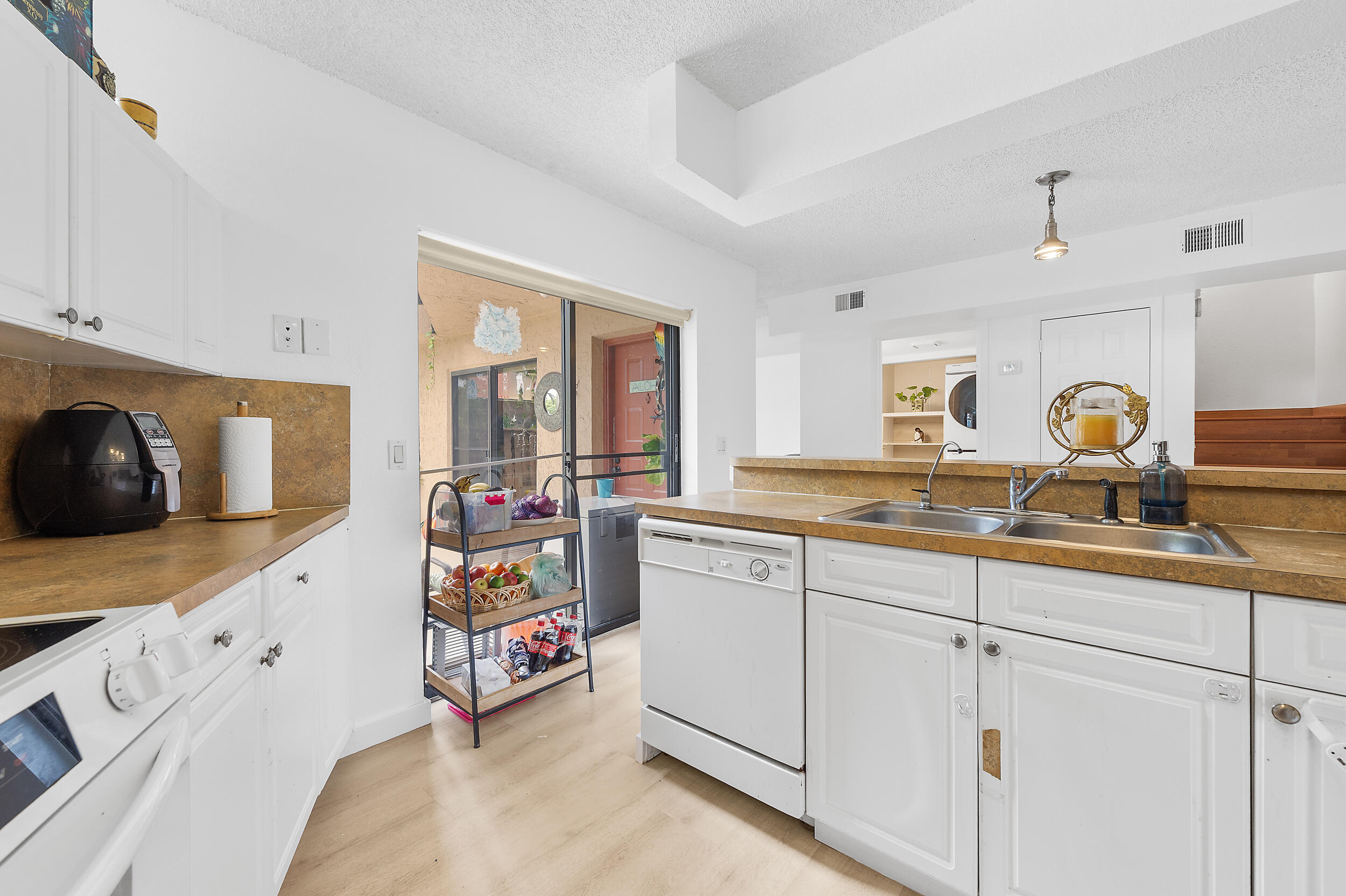 8141 Severn Drive, Unit B Boca Raton, FL 33433 - Photo 11 of 34 a utility room with sink dryer and washer