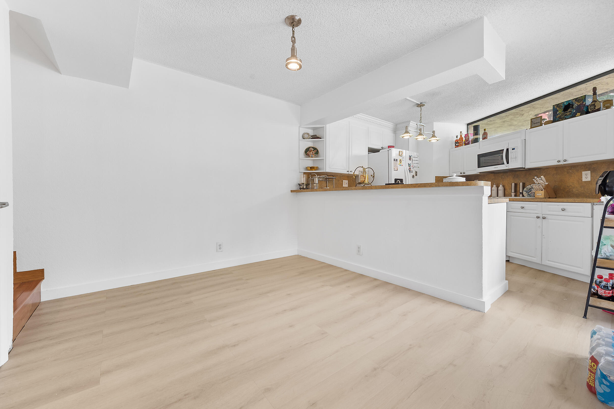 8141 Severn Drive, Unit B Boca Raton, FL 33433 - Photo 14 of 34 a view of a kitchen with a sink stainless steel appliances and cabinets