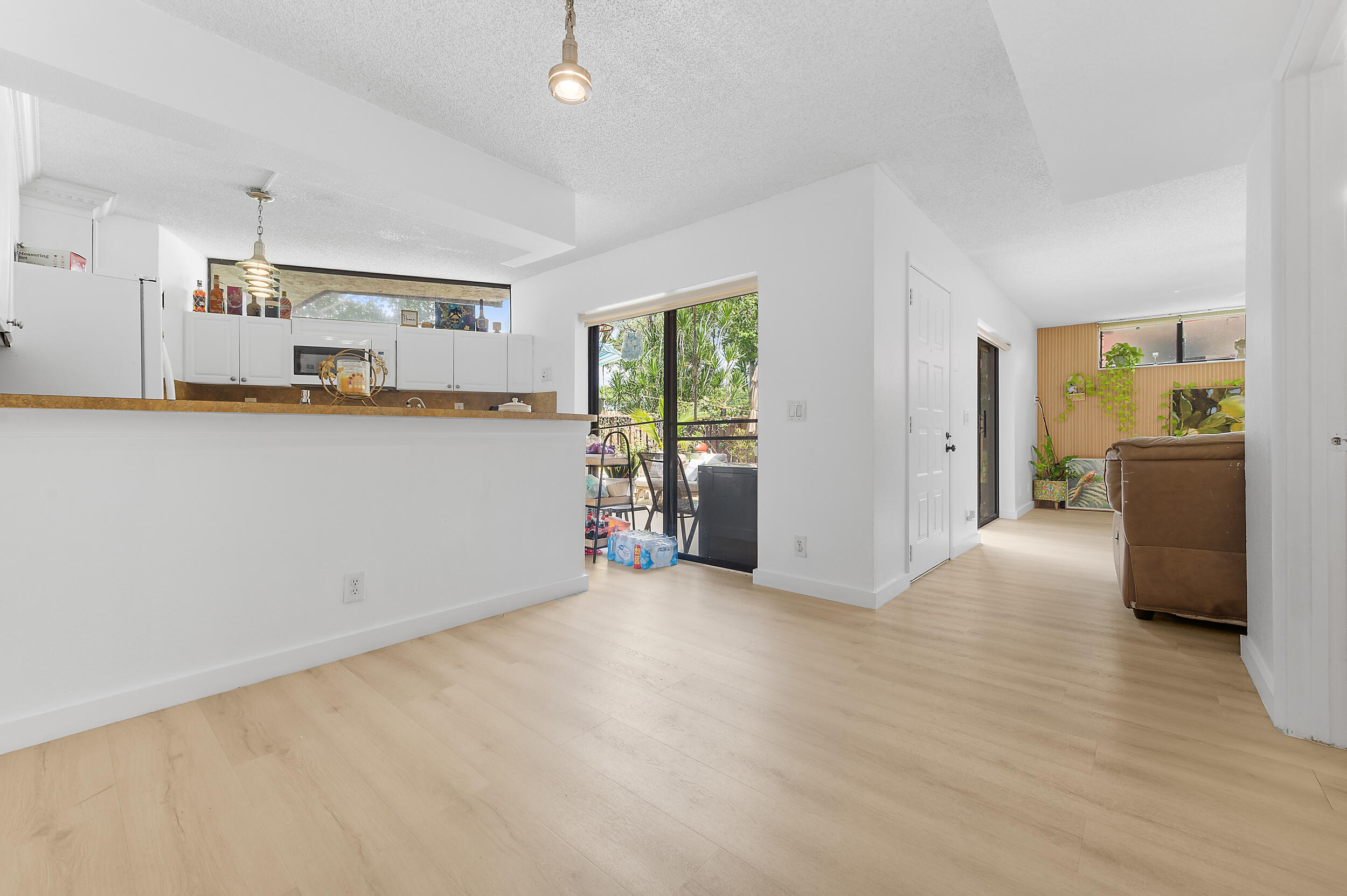 8141 Severn Drive, Unit B Boca Raton, FL 33433 - Photo 15 of 34 a view of a kitchen with a sink cabinets and a window