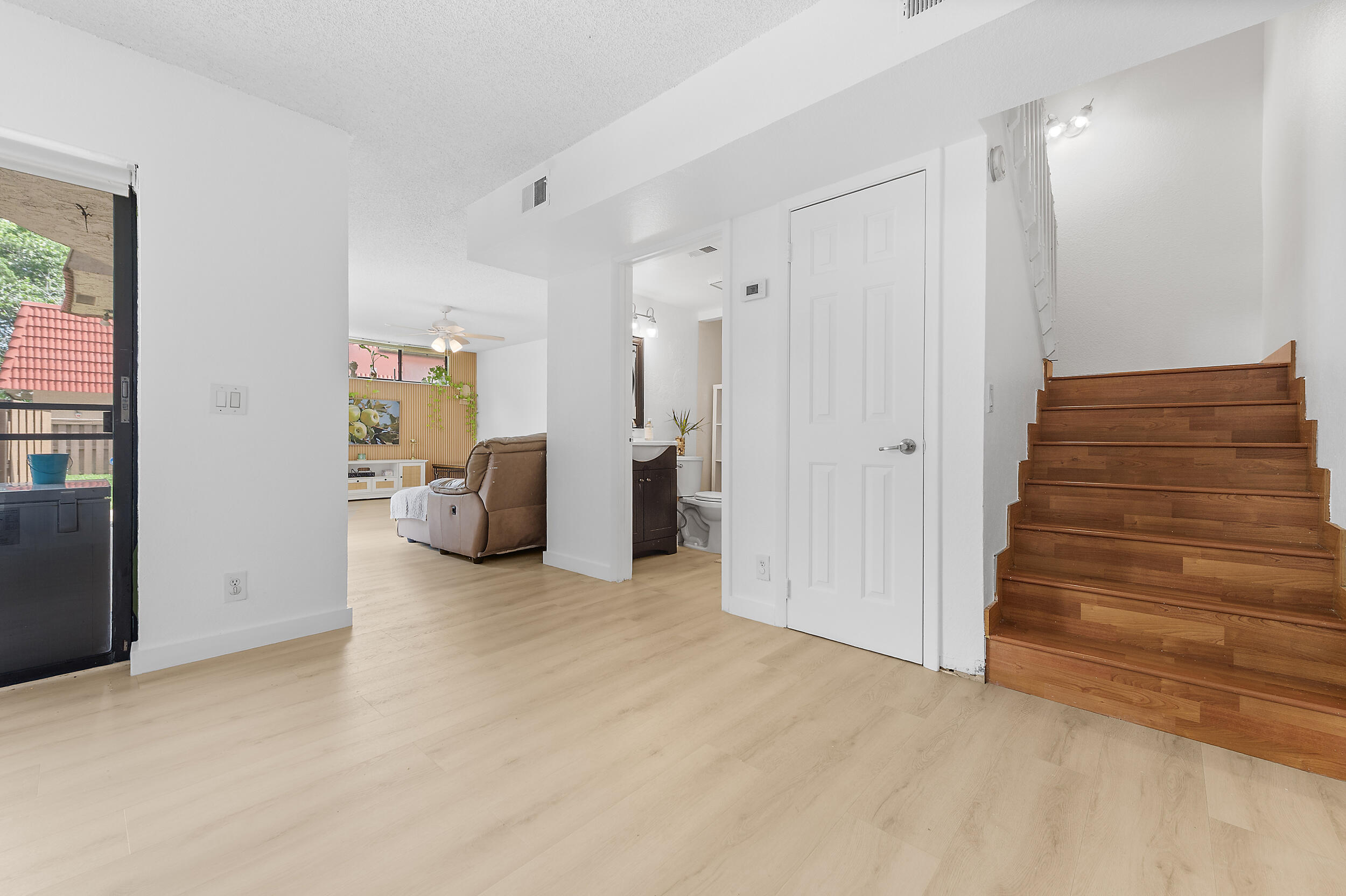 8141 Severn Drive, Unit B Boca Raton, FL 33433 - Photo 16 of 34 a view of a livingroom with wooden floor and closet