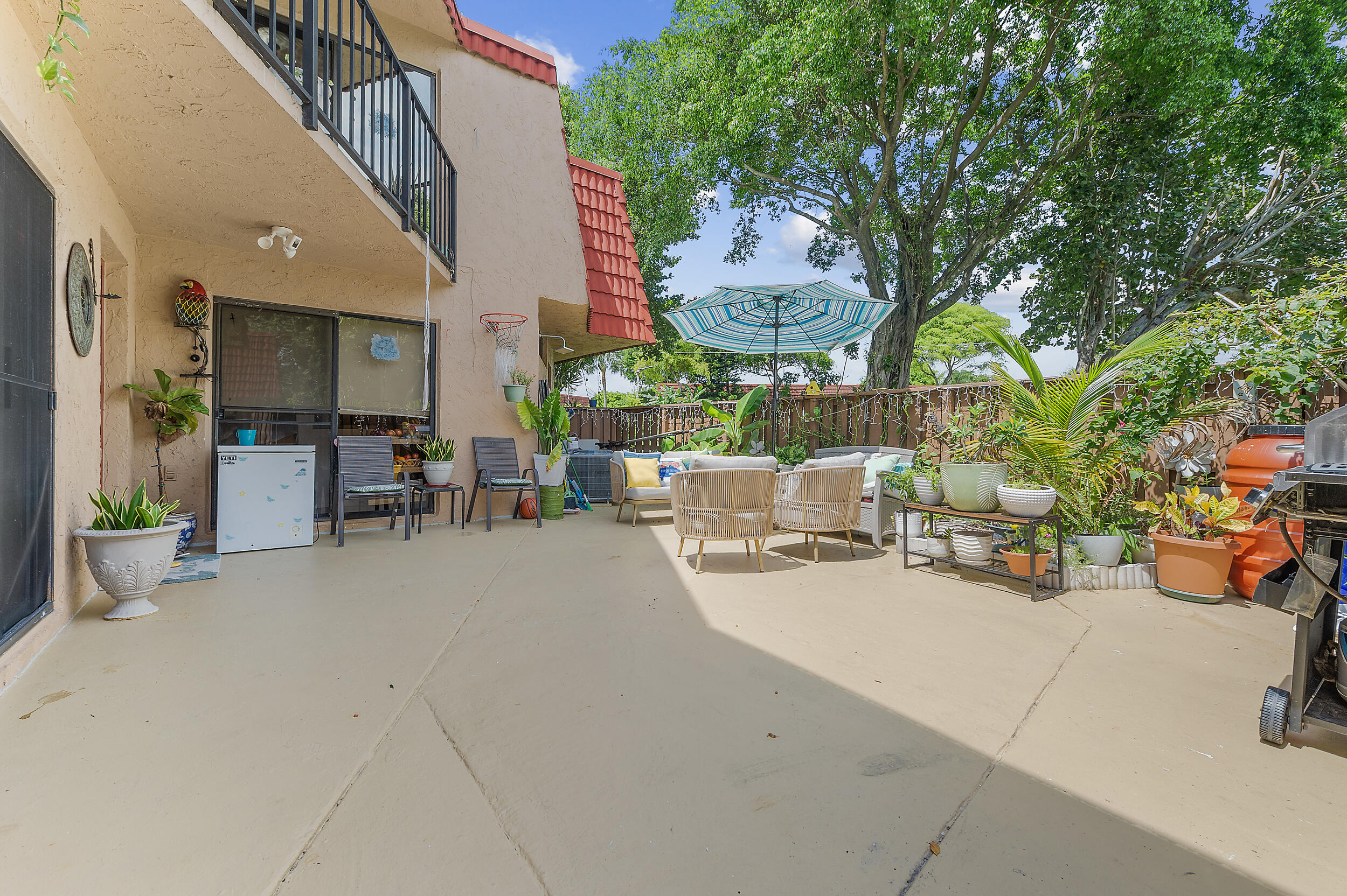 8141 Severn Drive, Unit B Boca Raton, FL 33433 - Photo 2 of 34 an outdoor space with patio furniture and potted plants