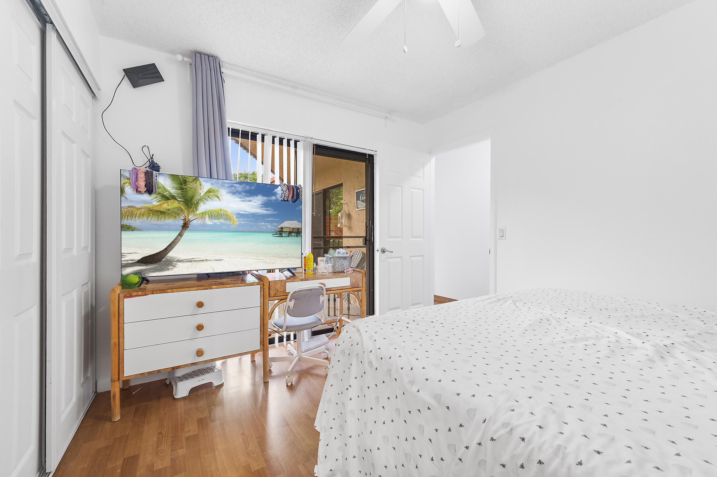 8141 Severn Drive, Unit B Boca Raton, FL 33433 - Photo 25 of 34 a bedroom with a bed dresser and a window