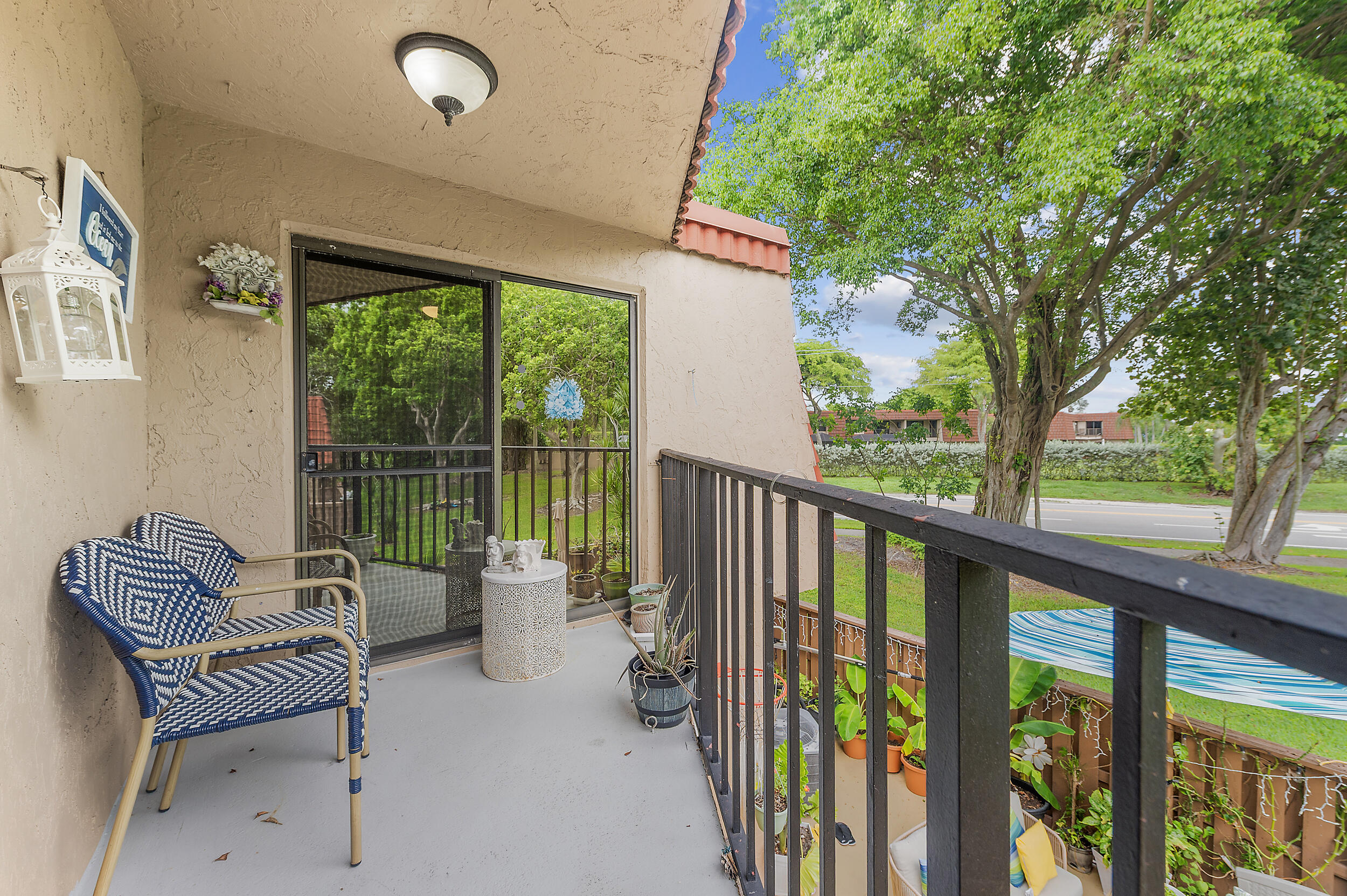 8141 Severn Drive, Unit B Boca Raton, FL 33433 - Photo 27 of 34 a balcony with furniture and iron gate