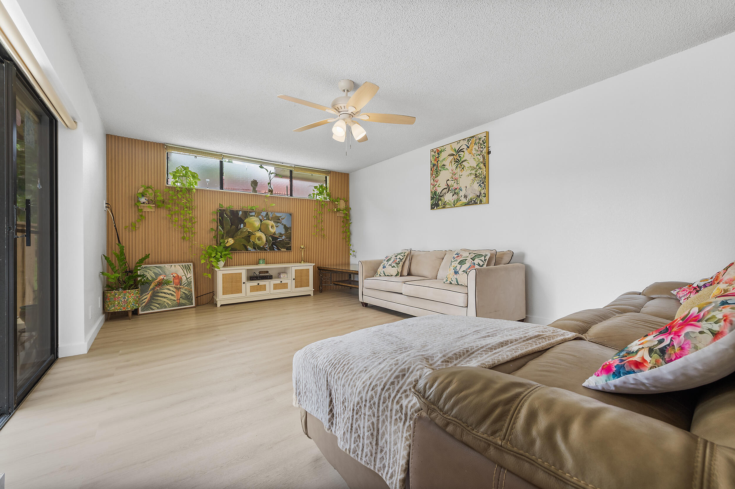 8141 Severn Drive, Unit B Boca Raton, FL 33433 - Photo 3 of 34 a spacious bedroom with a bed and a couch