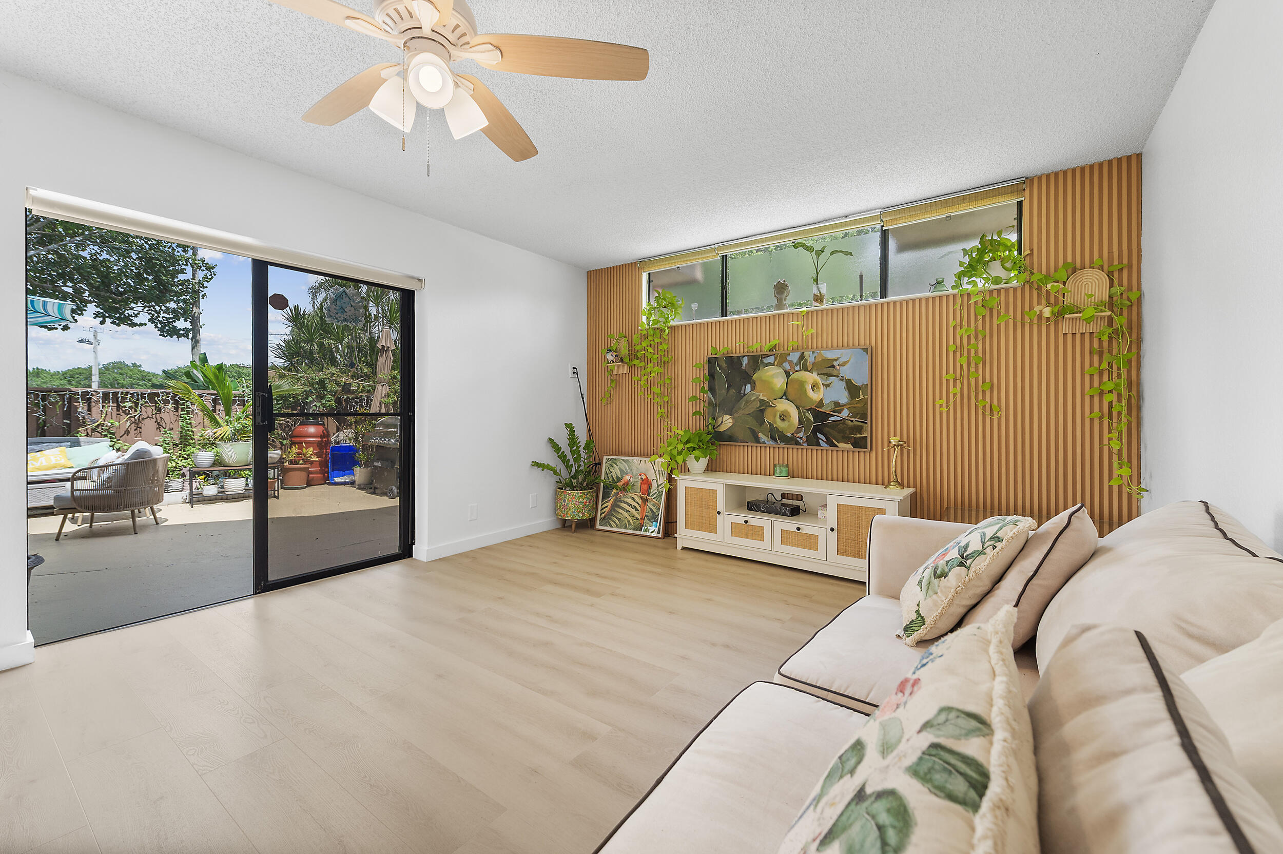 8141 Severn Drive, Unit B Boca Raton, FL 33433 - Photo 4 of 34 a bedroom with furniture and a large window