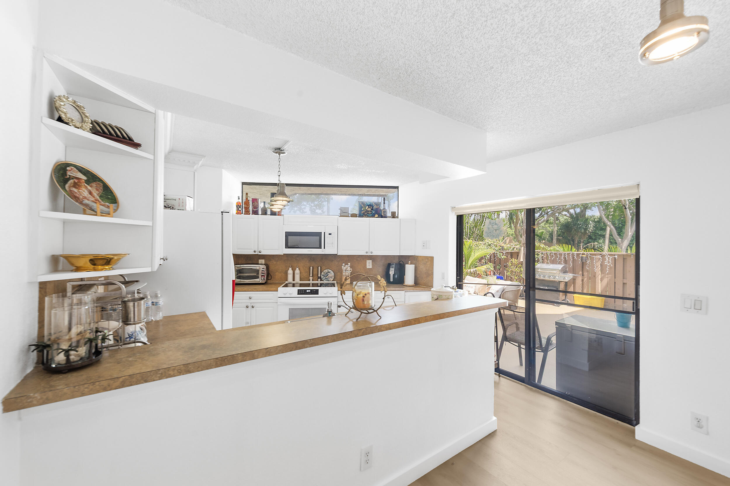 8141 Severn Drive, Unit B Boca Raton, FL 33433 - Photo 7 of 34 a room with a large window and a view of living room