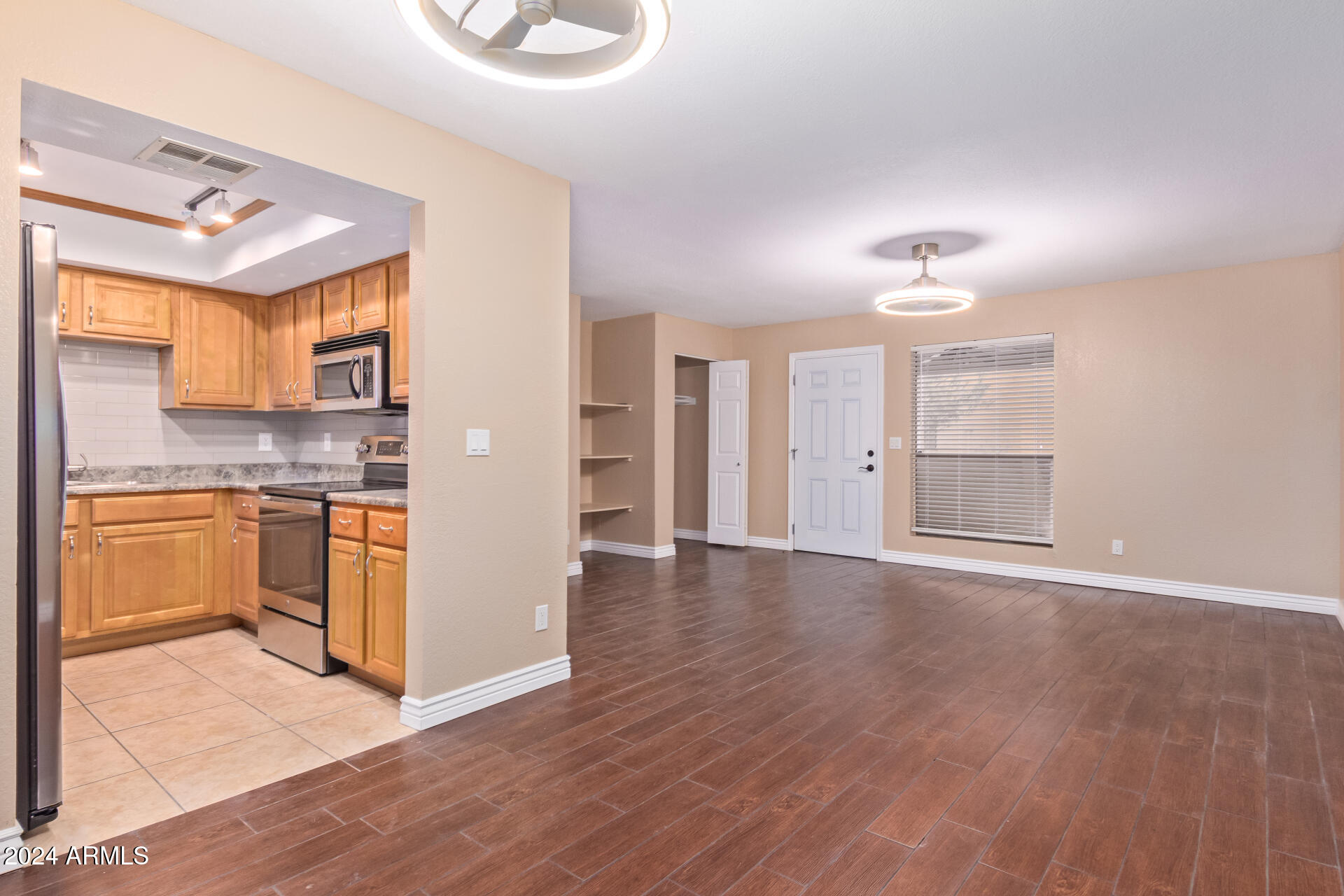 1340 North Recker Road, Unit 140 Mesa, AZ 85205 - Photo 6 of 24 great room into kitchen