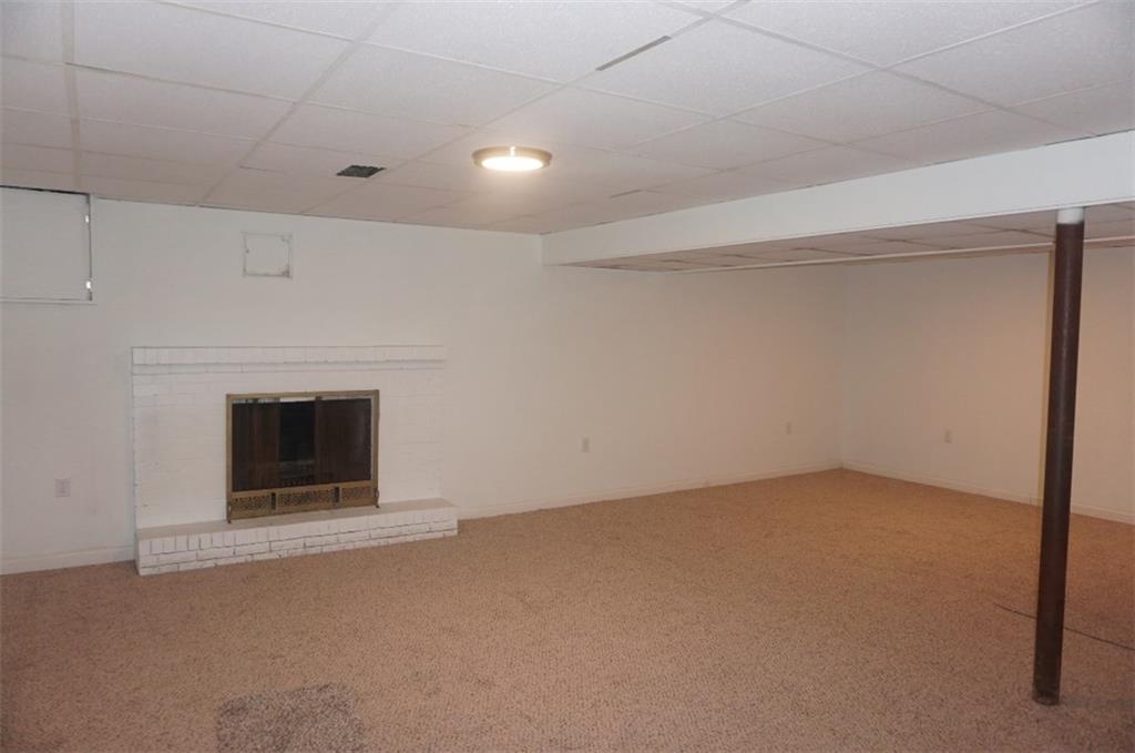 28 Walton Road Pittsburgh, PA 15236 - Photo 19 of 25 Fireplace in the the Finished Lower Level makes for the perfect Game room!