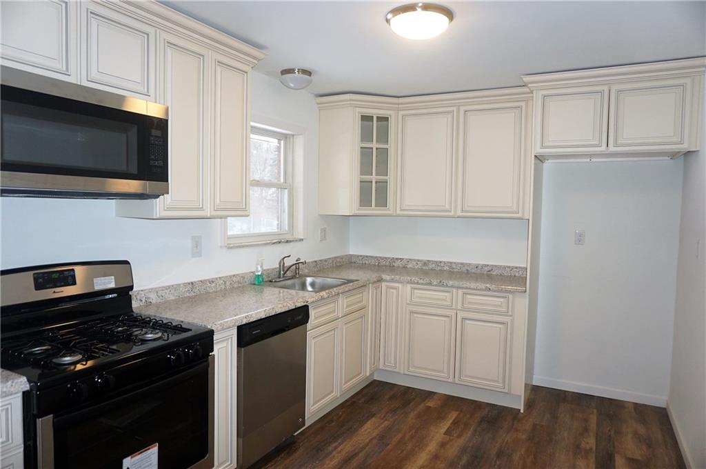 28 Walton Road Pittsburgh, PA 15236 - Photo 8 of 25 New Kitchen includes all new cabinetry, countertops, flooring, and appliances!