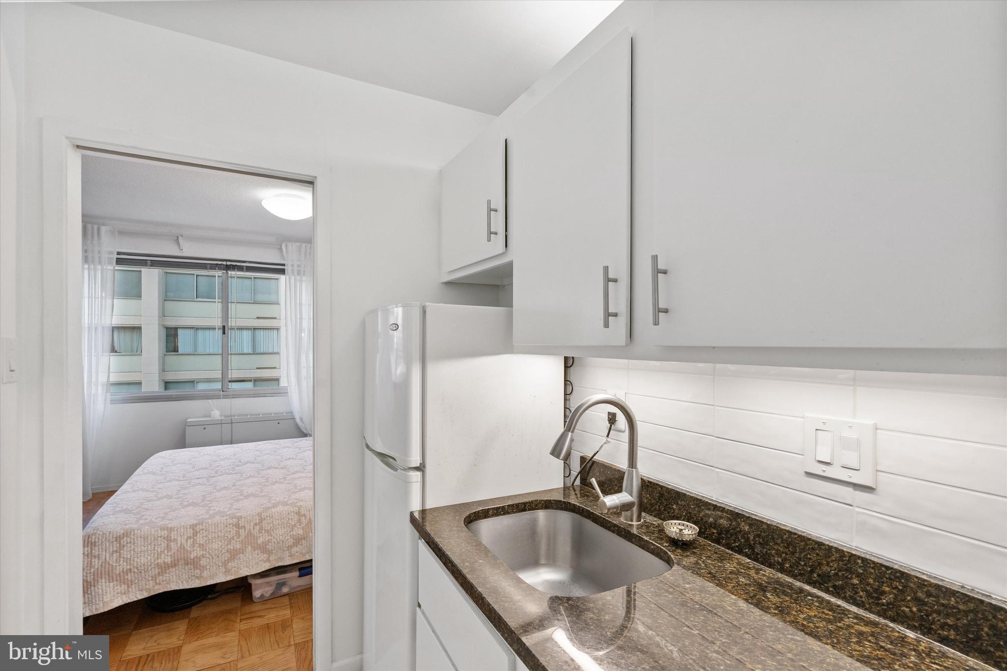 5500 Friendship Boulevard, Unit 2124N Chevy Chase, MD 20815 - Photo 9 of 24 a bathroom with a sink and a mirror