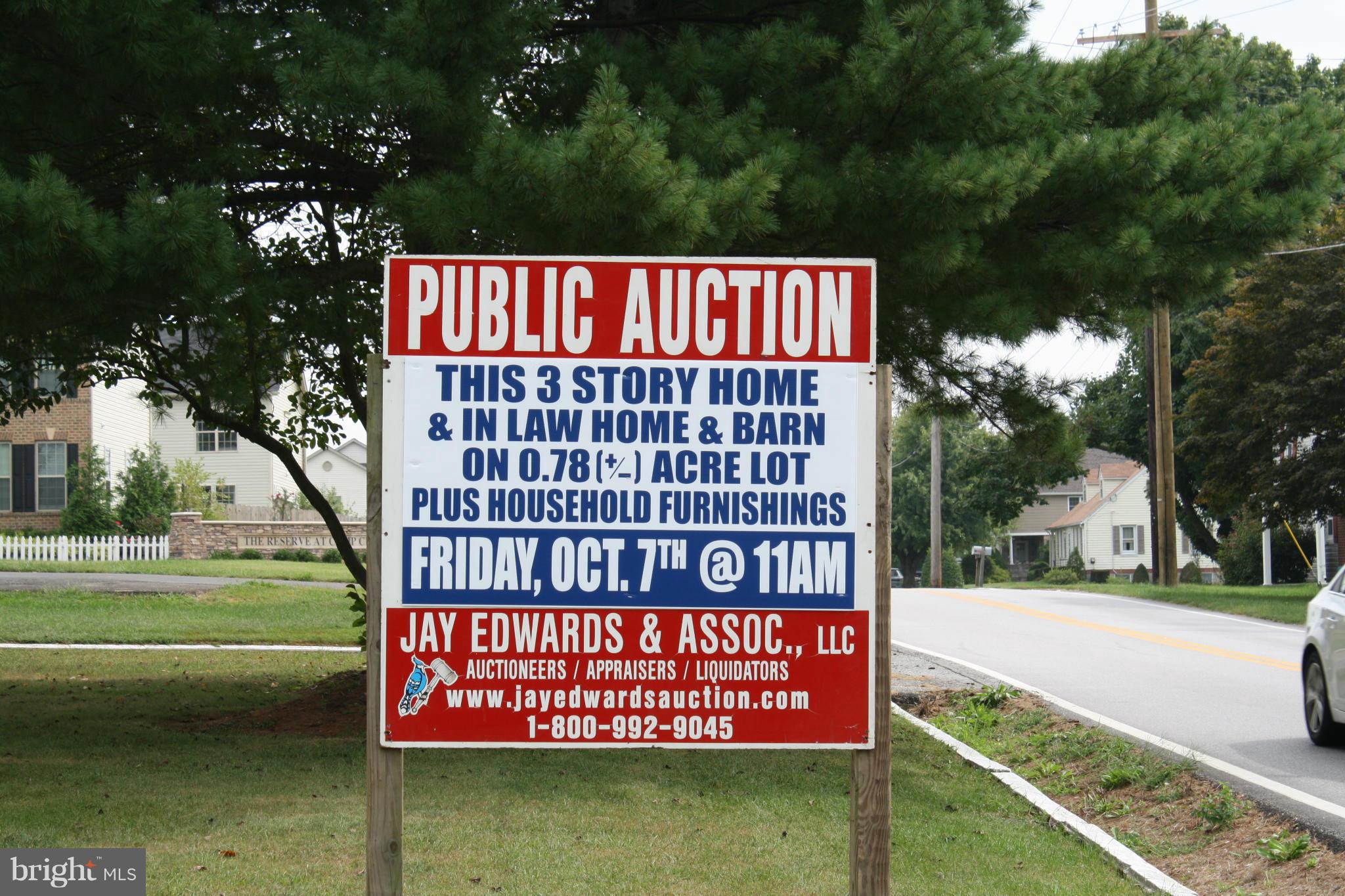 4304 Chapel Road Nottingham, MD 21236 - Photo 2 of 13 a sign on the side of the road